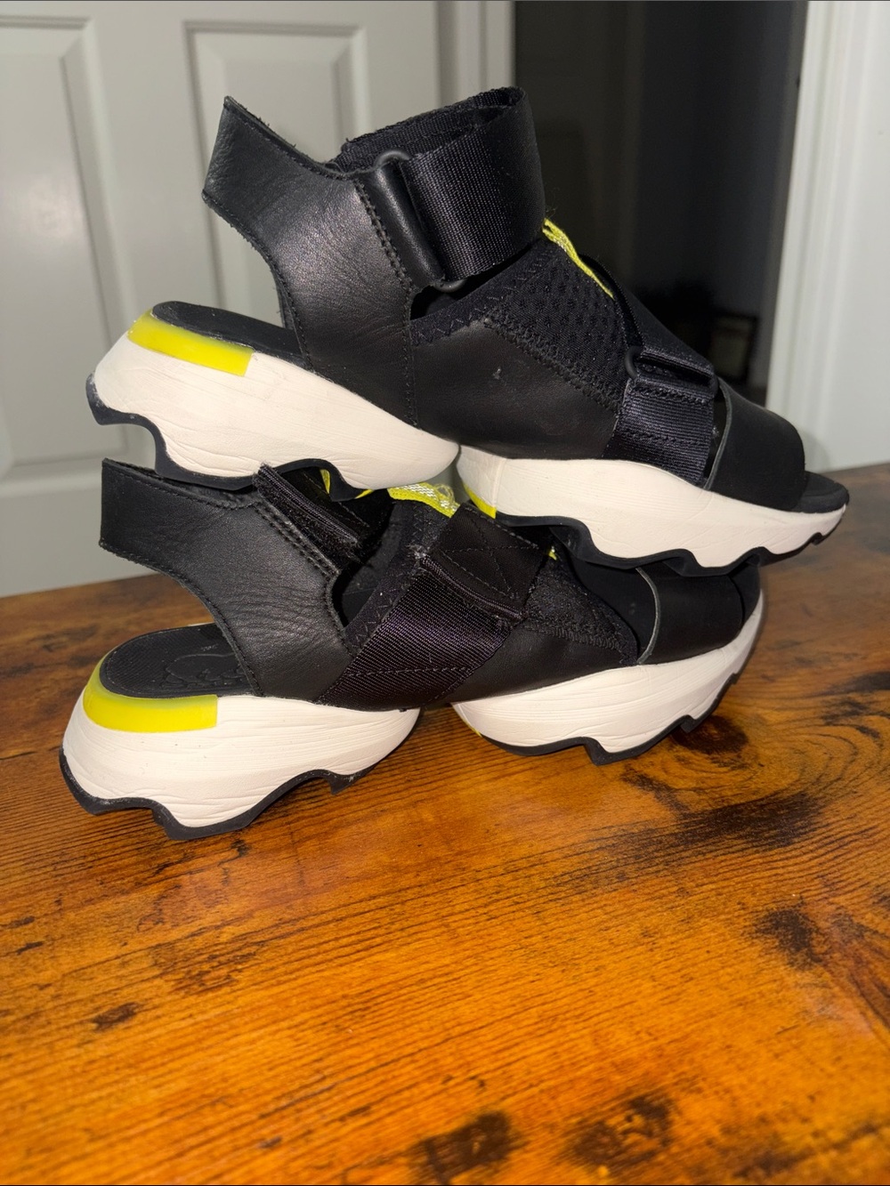 Sorel Black Sandals with White Soles and Yellow Accents